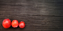Red Tomatoes On Wooden Background