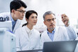 © Blue Jean Images - Researchers working in laboratory