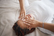 © C Davids/peopleimages.com - Insomnia and tired black woman relaxing on a bed in her bedroom thinking while covering her eyes. Depression, stress and mental health of a sad african girl with a headache after a breakup at home.