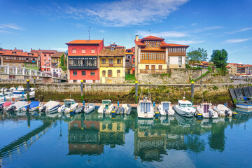 Fototapete - LLanes port with houses and boats in Asturias