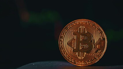 Poster - Bitcoin coin on background of a cryptocurrency trading chart on computer screen. Digital money, banking, investment, finance and business concept.