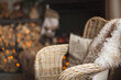 beautiful cozy christmas interior of a country house in the holidays. background with wicker chair, fireplace, firewood