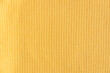  Ribbed cotton fabric texture yellow color  . Close up rib cotton cloth and textiles pattern. Natural organic fabrics texture background.