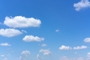 clear blue sky background with white clouds