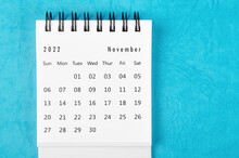 The November 2022 Monthly Desk Calendar For 2022 Year On Blue Background.
