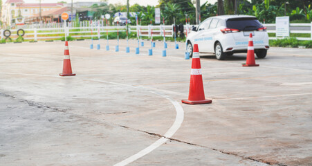 Traffic cones and car, driving school concept.