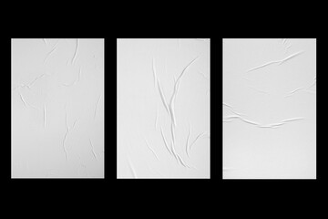 Wall Mural - Three white sheets of paper isolated on a black background.