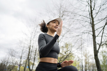 Wall Mural - A female runner is running fitness training in a tight-fitting tracksuit.