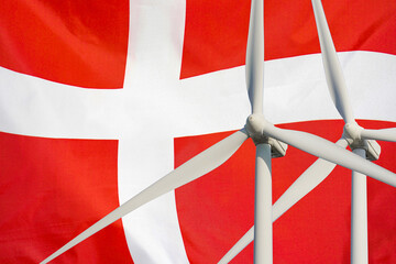 Wall Mural - Two Wind Turbines for alternative energy on Denmark flag background. Energy development and energy crisis. Eco power and Wind stations for renewable electric energy production in Denmark