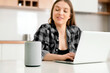 © Proxima Studio - Woman using smart speaker