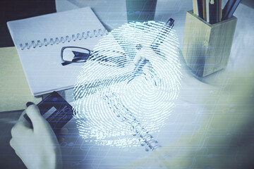 Poster - Multi exposure of woman on-line shopping holding a credit card and finger print drawing. Security concept.
