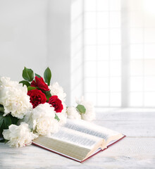 Poster - Bible and a bouquet of peonies on a table