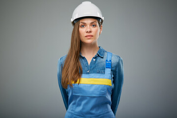 Wall Mural - Serious woman architect or engineer in white safety helmet. Isolated female portrait.