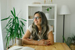 © STUDIO TAURUS - Portrait of cheerful adult businesswoman working from home, she is hawing a break and drinking coffee