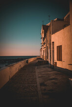 Old Street On The Italian Coast With White Buildings During Sunset