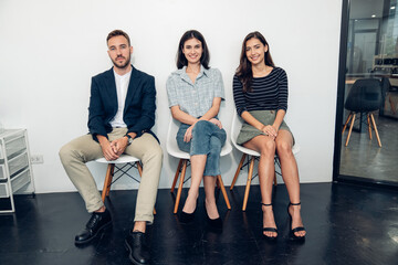 Wall Mural - Successful business team, Smiling businesspeople having a discussion in an office