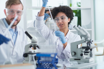 team of medical research scientists working on generation experimental drug