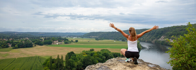 Rear view of woman looking at landscape panorama view