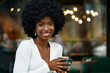 © fotofabrika - Young woman taking break and drinking coffee in cafe