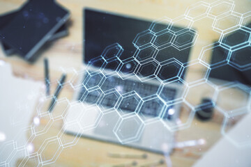 Poster - Creative concept of wireless technology with hexagon hologram on modern laptop background. Big data and database concept. Multiexposure