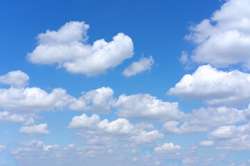 Wall Mural - clear blue sky background with white clouds