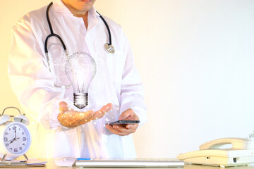 Poster - Hands holding a light bulb, concept of innovation and inspiration Hologram virtual interface for medical technology, digital healthcare, and network connection