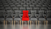 Red Chair Stands Out Among Rows Of Gray Fabric Chairs. 3D Illustration