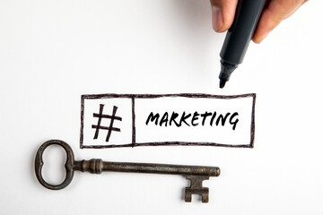Sticker - Marketing concept. Old door key and hashtag symbol on white background