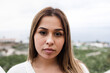 © DisobeyArt - Young hispanic girl looking at camera outdoor - Focus on face