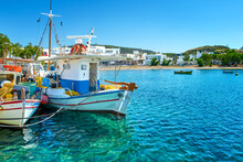 Beautiful View Of Greek Fishing Boats Anchored In A Small Village