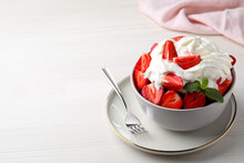 Delicious Strawberries With Whipped Cream Served On White Wooden Table. Space For Text