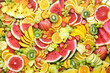 Fresh ripe bright colorful fruits from market: watermelon and orange, grapefruit and lemon, mango and berries, apple and banana