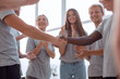 © ASDF - close up. contact group leaders shake hands.