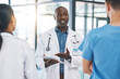 © C Davids/peopleimages.com - Team, nurse and medical doctors in a discussion about healthcare report, review and results in a hospital. Global, teamwork and leader in conversation with nursing professionals after office meeting