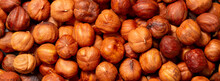 Heap Of Hazelnuts Close-up. Peeled Nuts. Hazelnut Isolated On White Background.