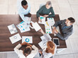 © C Davids/peopleimages.com - Business meeting, planning and marketing with employee and top view of documents for strategy, teamwork and collaboration. Vision, conference and support with business people at desk in office