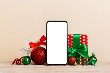 digital phone mock up with rustic christmas decorations for app presentation with empty space for yo