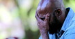 © Marco - Worried African man covering face with hand having difficulties