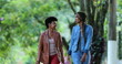 © Marco - Two best friends walking outside. African American women