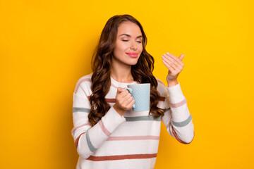 Poster - Portrait of pretty positive lady closed eyes hold smell fresh coffee aromat isolated on yellow color background