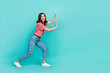 Full length photo of nice pretty lady hold carry touch empty space interested look promo isolated on aquamarine color background