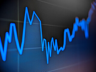 Stock market financial price chart with blue line graph displayed on a pixelated monitor with dark background