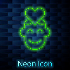 Sticker - Glowing neon line Volunteer icon isolated on brick wall background. Vector