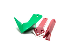 Set Of Plastic Scrapers For Silicone On A White Background