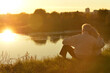 © aletia2011 - Elderly couple is sitting together at sunset. Back view.