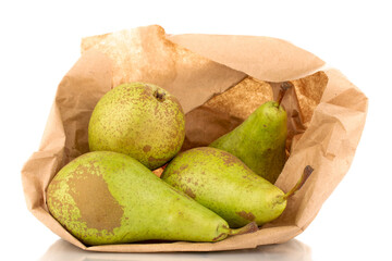 Wall Mural - Several juicy organic pears in a paper bag, close-up, isolated on a white background.