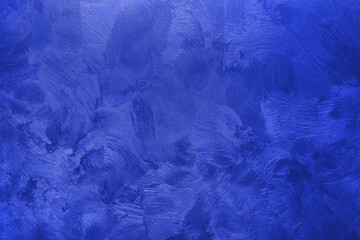 Abstract background of textured wall of blue color.