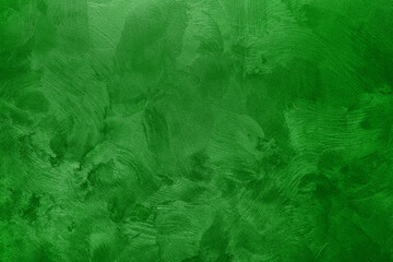 Abstract background of textured wall of green color.