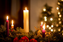 Christmas Candles On An Advent Wreath In Dark Church
