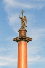 Sculpture Of An Angel On The Alexander Column In St. Petersburg On Background Of Blue Sky With Cloud